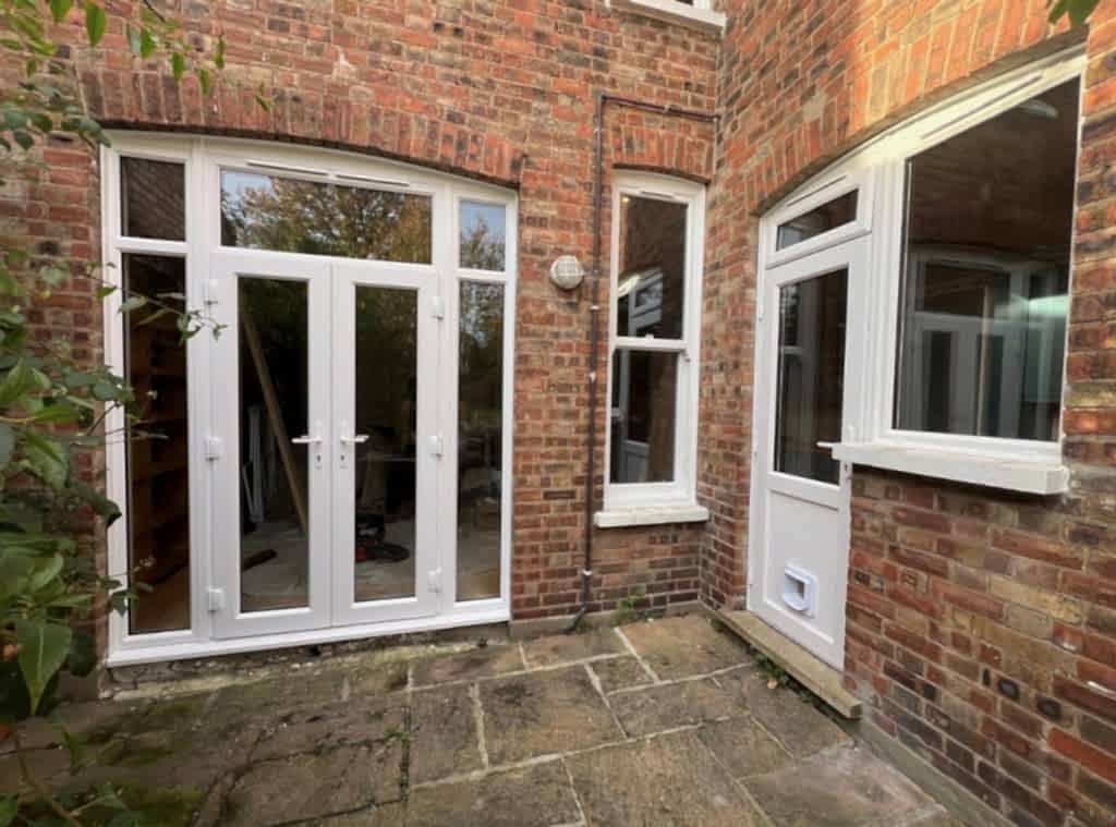 An installation featuring the Ultimate Contemporary Range and a traditional-style sash window, giving the customer the best of both worlds, contemporary efficiency alongside classic character.